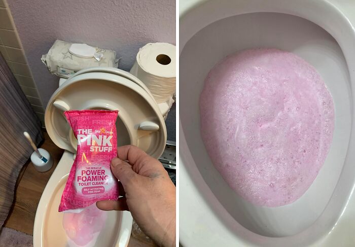 Hand holding pink toilet cleaner over toilet bowl with pink foam cleaning inside, showcasing items that fix things.