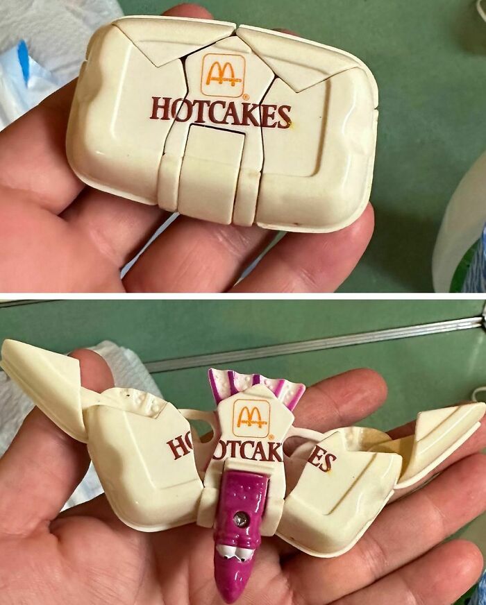 Old McDonald's Hotcakes Tamagotchi toy held in hand, showing vintage handheld digital game from the 90s era.