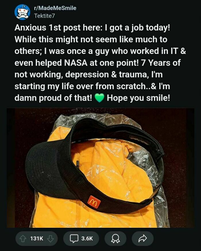 Black McDonald's visor on an orange jacket, symbolizing new beginnings and faith in humanity restored.