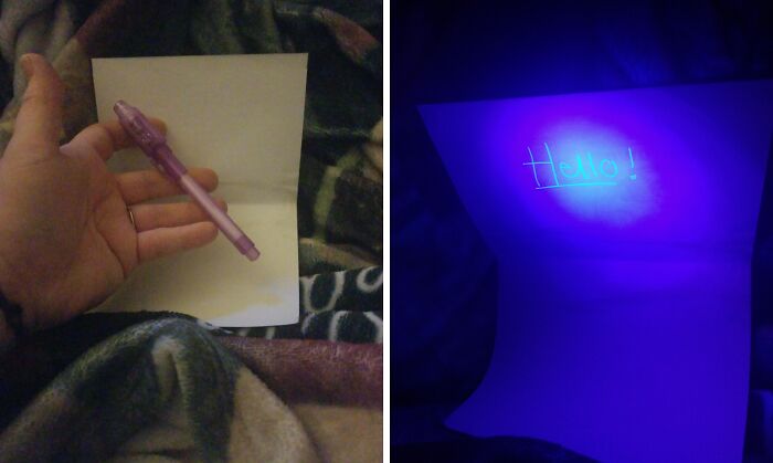 Hand holding a glow-in-the-dark pen writing on paper, showing a glowing message under UV light, a non-candy treat idea.