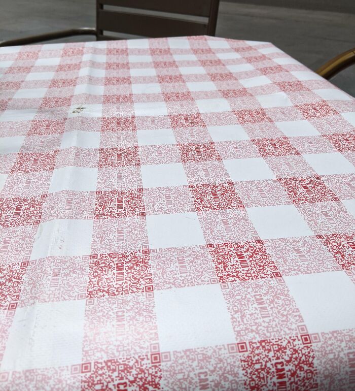 The Classic Red Checkered Pattern Of The Tablecloth In This Restaurant Is Made Of QR Codes For Their Menu