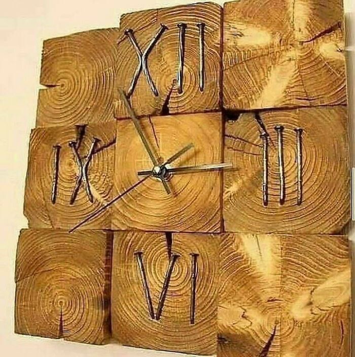 Woodworkers crafted a unique clock from natural wood blocks with Roman numerals carved into each piece.