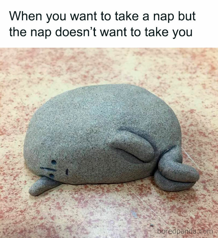 Funny meme of a cartoonish, gray clay blob with a face, playfully lying on a speckled surface.