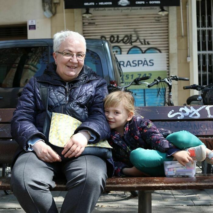 Older woman and young girl sharing a moment on a bench, capturing moving stories from Humans of New York.