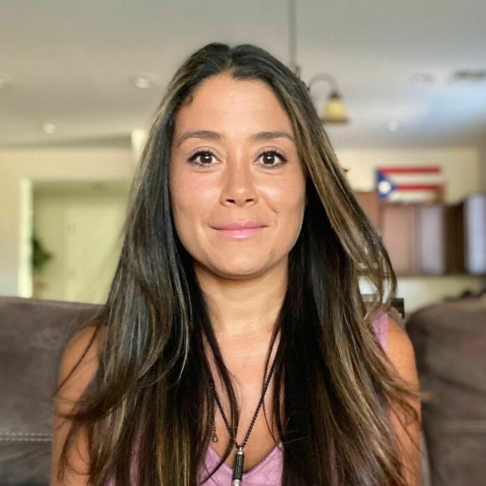 Woman with long dark hair sitting indoors, sharing one of the most moving stories from Humans of New York.