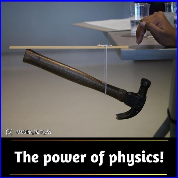 Hammer suspended by string from a stick resting on table edge demonstrating fascinating facts shared on amazing facts.