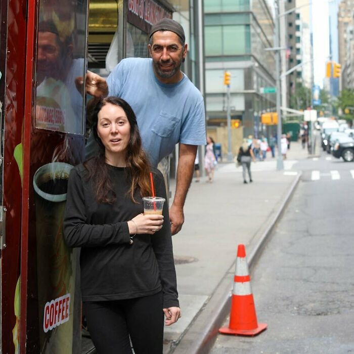 Two people sharing a moment on a busy city street, capturing moving stories from Humans of New York.