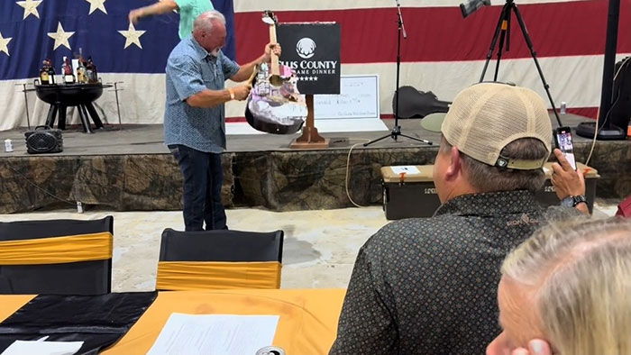 Man Smashes Taylor Swift-Signed Guitar Bought For $4000 At Auction, Fans Furious Man Smashes Taylor Swift-Signed Guitar Bought For $4000 At Auction, Fans Furious