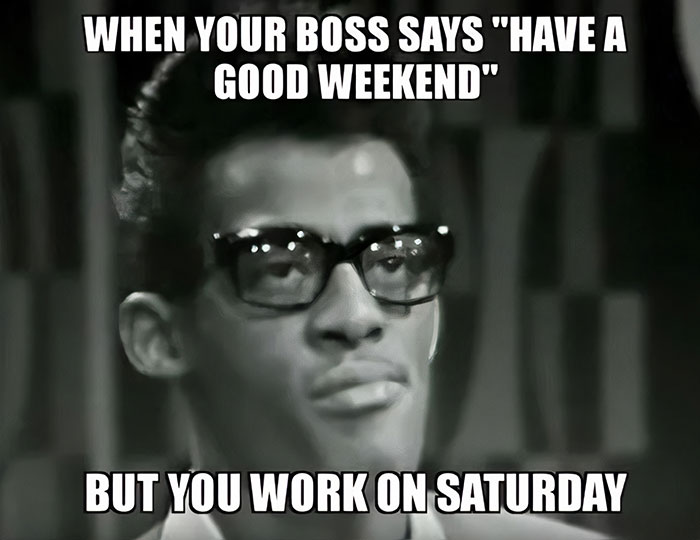 Black-and-white Saturday meme of a man with glasses, expressing irony about working on Saturday despite weekend wishes.