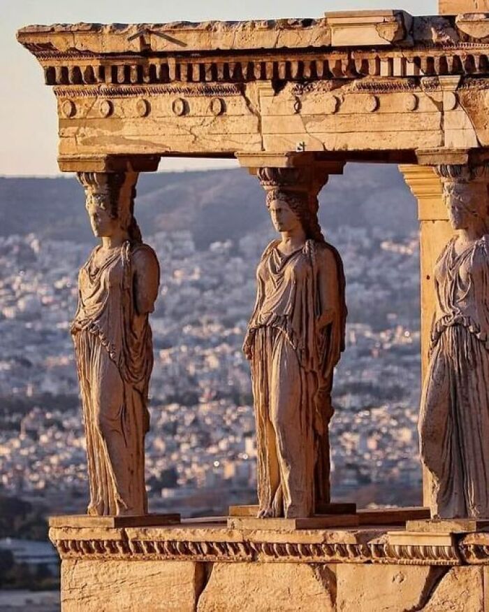 Ancient marvels: Caryatids of the Erechtheion at sunset, showcasing intricate Greek sculpture and architecture.