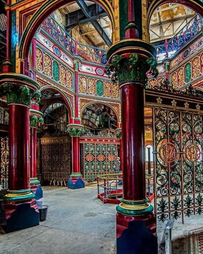 Intricate interior of ancient architecture with colorful pillars and ornate designs showcasing historical marvels.
