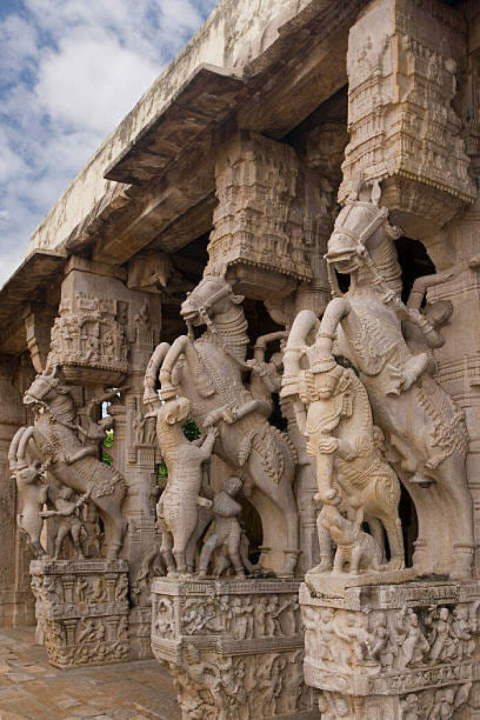 Intricately carved stone horses at an ancient marvel site, showcasing exquisite historical craftsmanship.