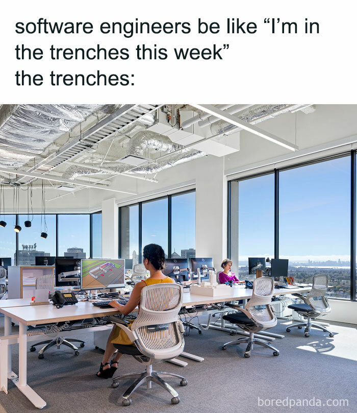 Open office with engineers at desks, illustrating a humorous take on their profession.