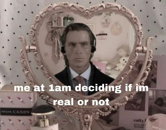 A man in a suit reflects in a heart-shaped mirror with the caption about life's ups and downs: "me at 1am deciding if im real or not."