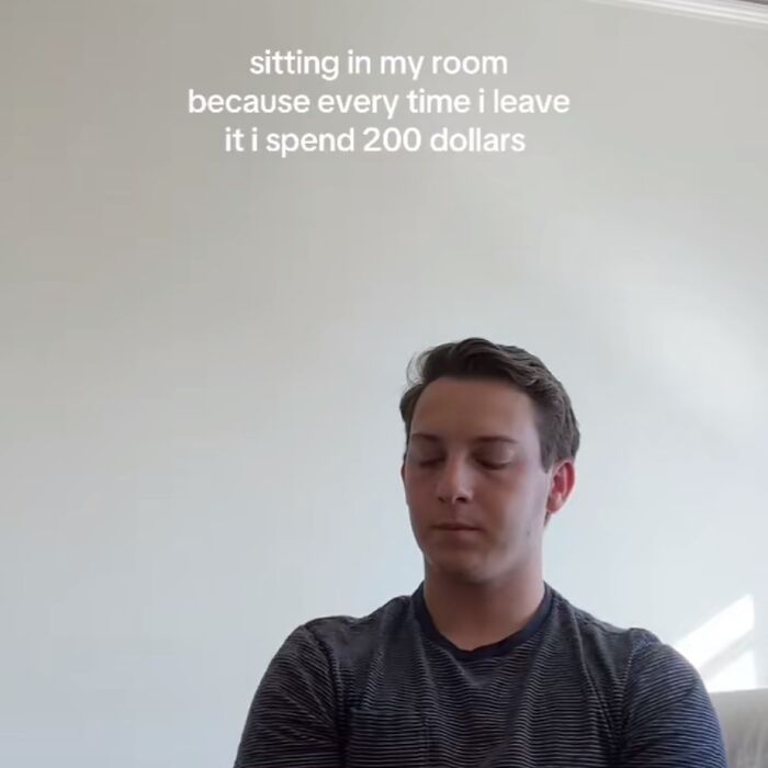 Man in a striped shirt with eyes closed, caption about life's ups and downs, staying in to avoid spending money.