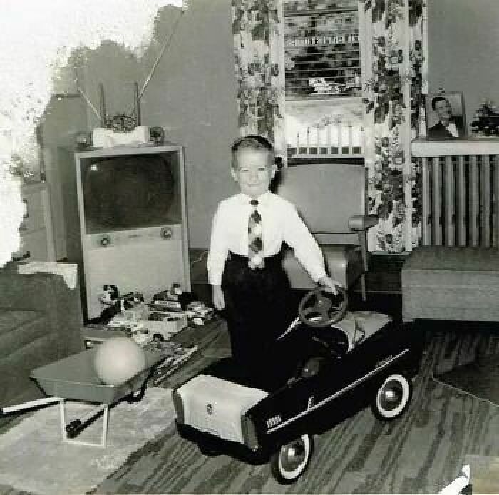 A Little Boy All Dressed Up Standing By His New Pedal Car. 1958