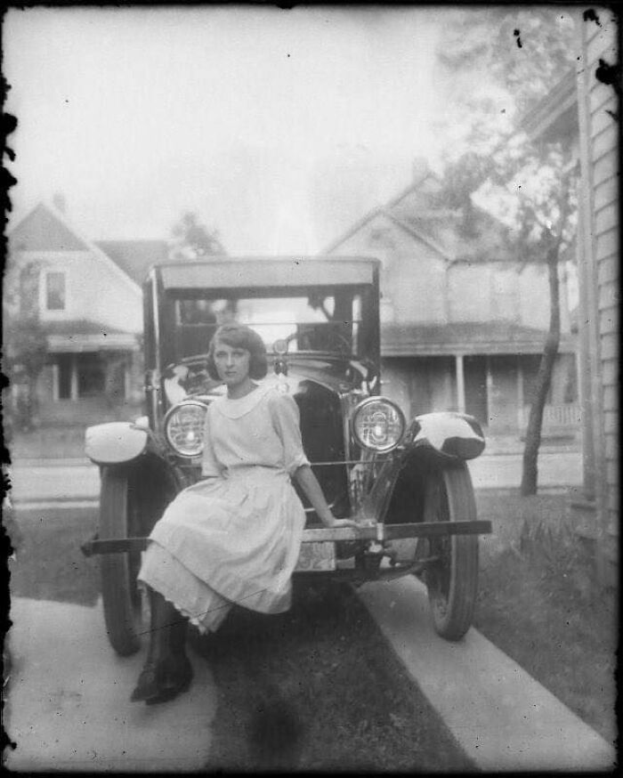 A Cool Girl Posing With Her Car Around 1920