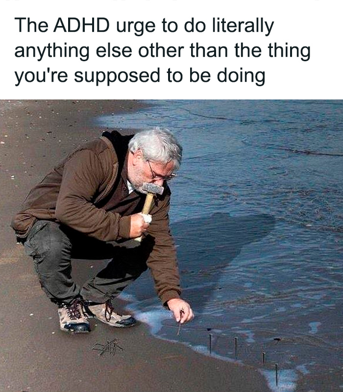 Man with a hammer distractedly hammering nails into a beach, illustrating a relatable ADHD moment.