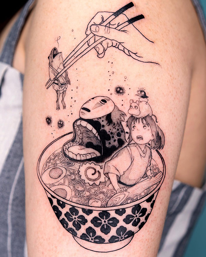 Anime-inspired tattoo ideas for men featuring a surreal ramen bowl scene with detailed characters, including a hand using chopsticks to lift a small creature, blending fantasy elements with intricate linework.