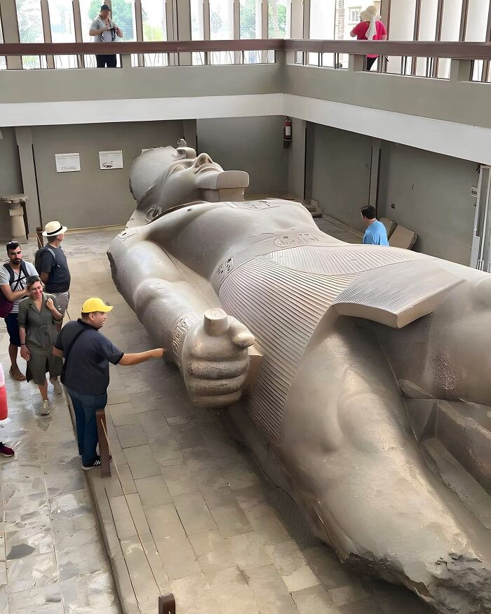 The Colossal Statue Of Ramesses II In Memphis, Egypt, Stands As An Impressive Relic Of Ancient Times