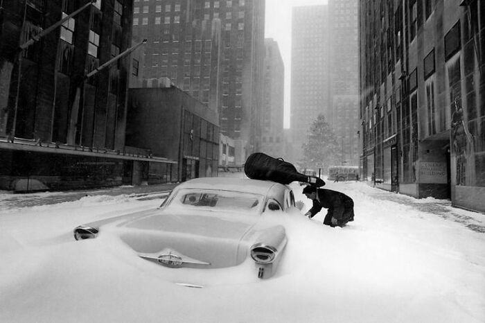 New York, USA - 1960: French Cellist Maurice Baquet Trying To Open His Car Covered With Snow During A Snow Storm 