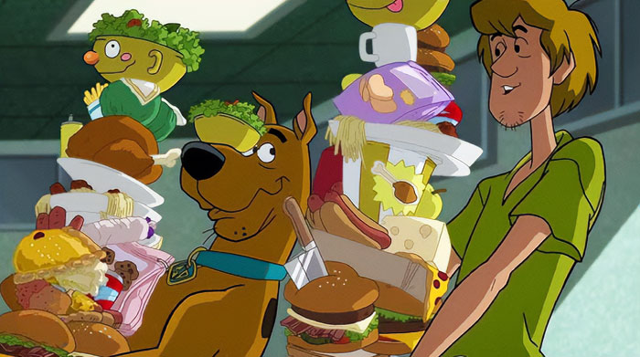 Animated iconic duo enjoying a large stack of food.