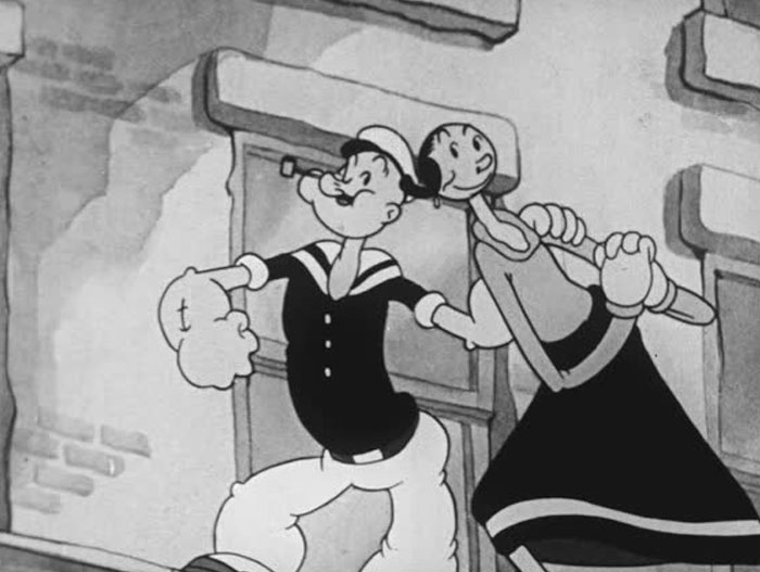 Iconic duo of Popeye and Olive Oyl walking arm in arm in a vintage cartoon scene.