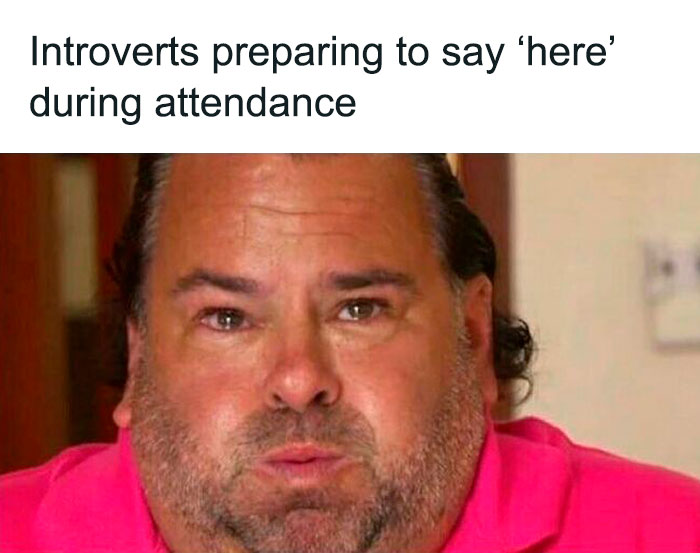 Man in a pink shirt looking nervous, capturing a funny and relatable moment about life as an introvert during attendance.