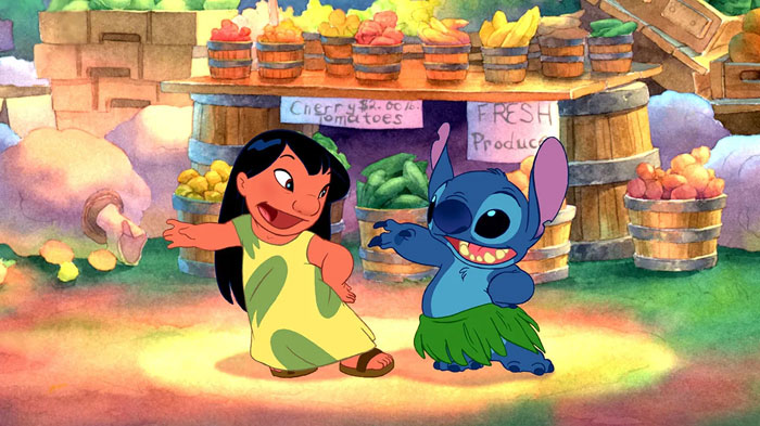 Animated duo dancing in a vibrant market with fruits and vegetables in the background.