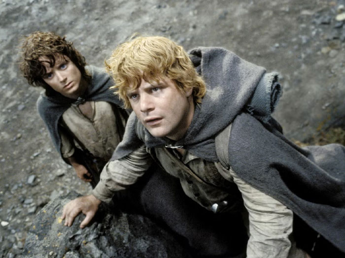 Two characters in rugged clothing, a representation of iconic duos in cinematic history.