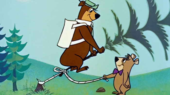 Cartoon bears using a homemade seesaw, representing iconic duos.