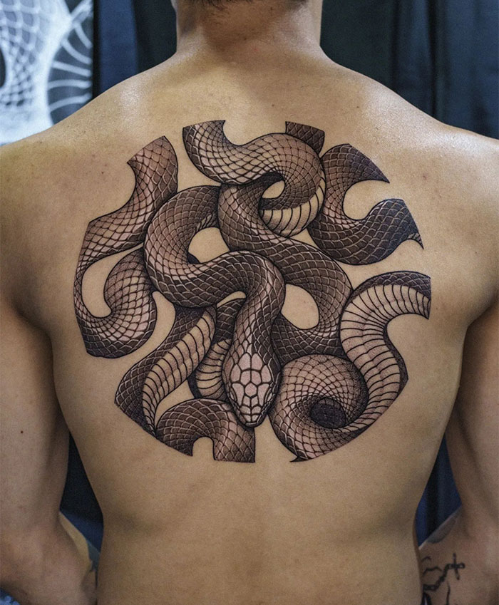  Back tattoo ideas for men featuring an intricate design of intertwined snakes, emphasizing detailed scales and a central head for a bold and striking look.