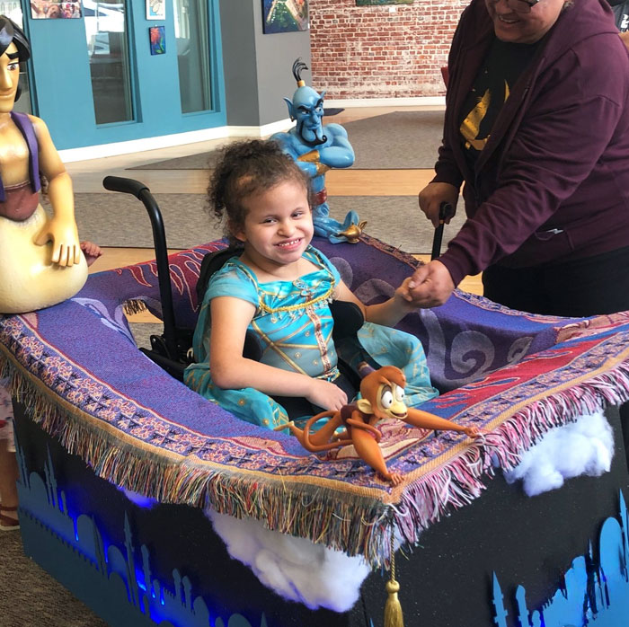 Caroline Is Looking Extra Magical Riding On Her Magic-Carpet Wheelchair