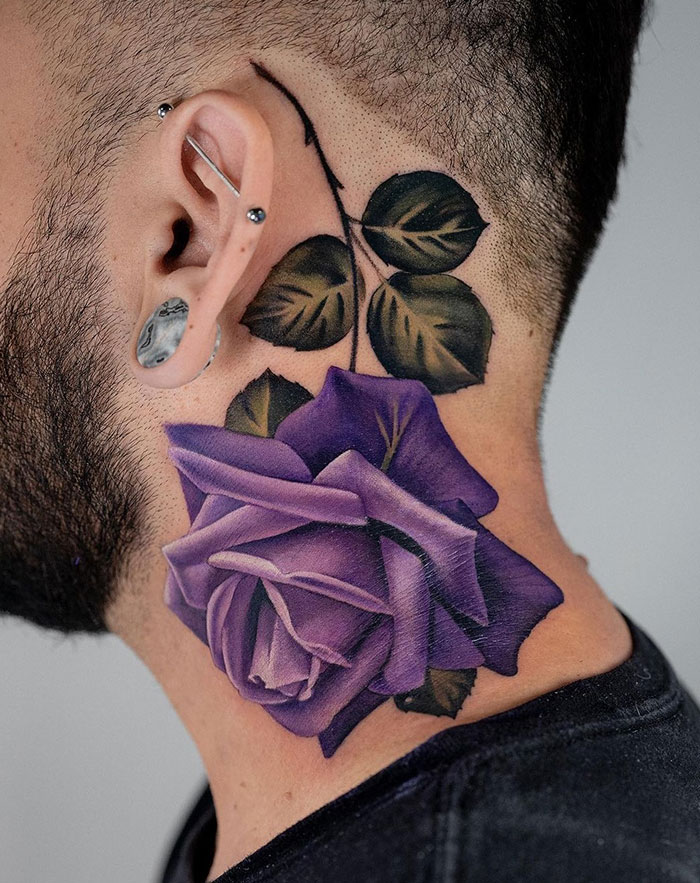  A realistic neck tattoo featuring a vibrant purple rose with detailed shading and green leaves, placed behind the ear. Tattoo ideas for men who prefer bold, colorful floral designs with a sophisticated touch.