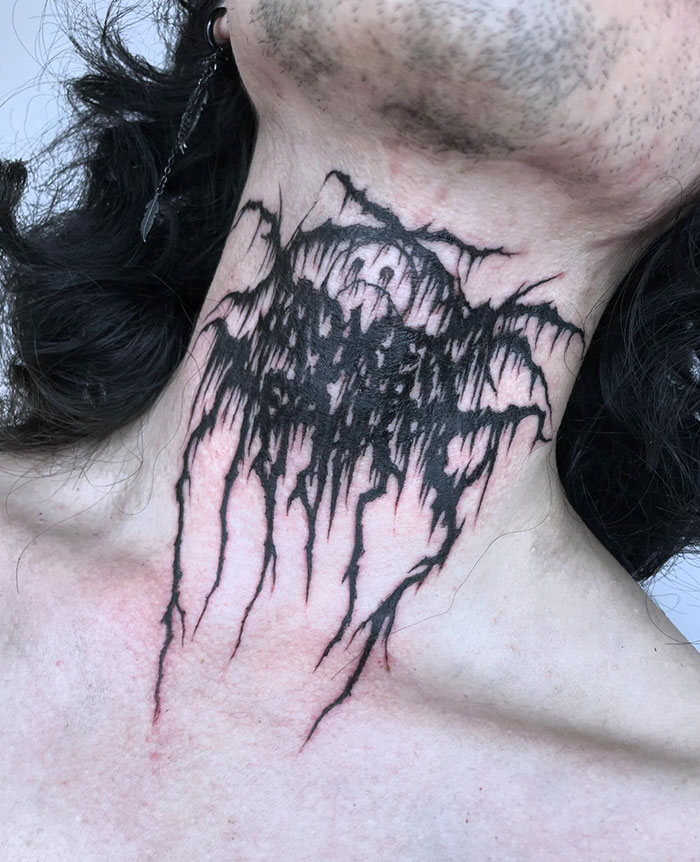  A dark and intricate neck tattoo featuring jagged lines and abstract, chaotic patterns. Tattoo ideas for men who prefer bold, intense designs with a grunge or metal-inspired aesthetic.