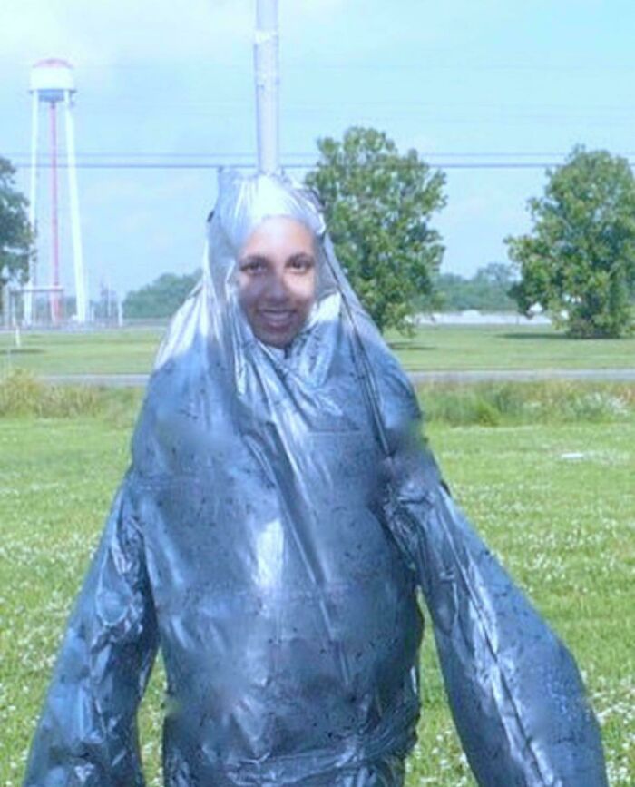 Person wrapped in duct tape outdoors, a humorous moment from their blunder years.