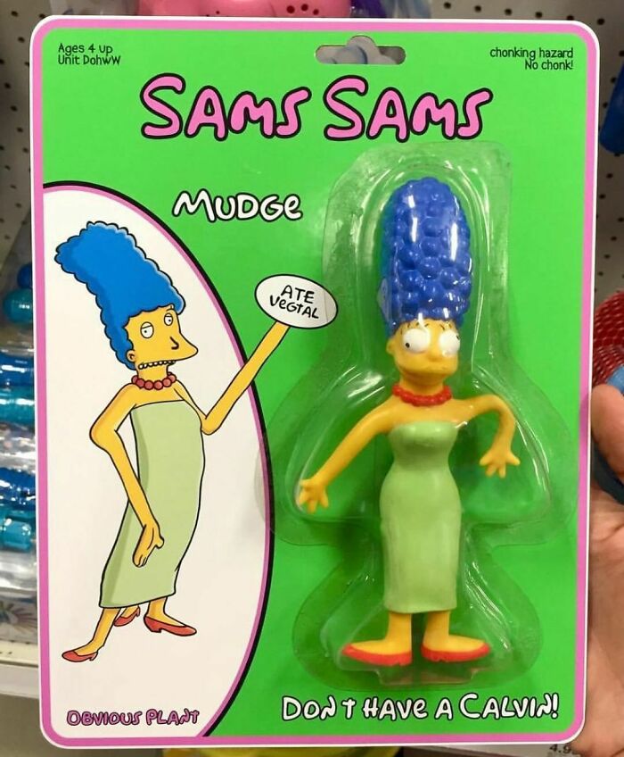 Fake product of a cartoon character with blue hair and green dress, showcasing a humorous parody in a retail package.