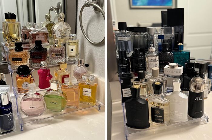 Collection of luxury perfume bottles displayed neatly on a clear organizer, showcasing expensive taste on a humble budget.