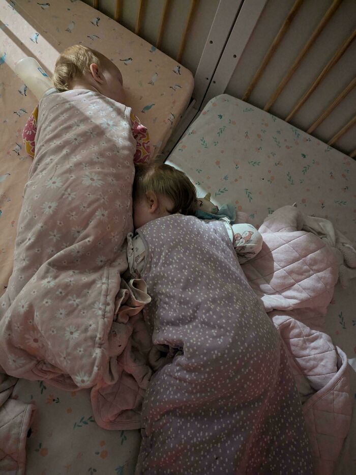 Two toddlers sleeping peacefully in cribs, showcasing wholesome and funny dads doing their best parenting moments.