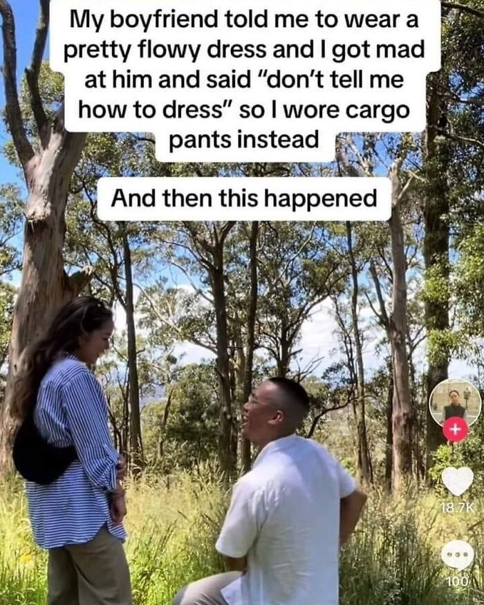Couple in a forest, man kneeling and proposing with text about wearing cargo pants for a funny meme moment.