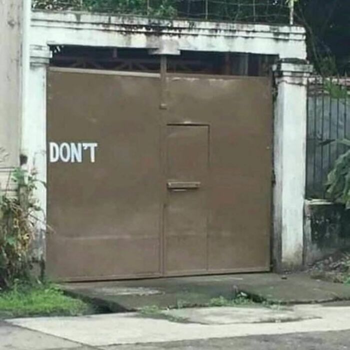 Brown metal gate with a small door cut into it, partially covered by the word "DON'T," captured in random photos.