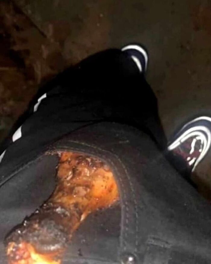 Grilled chicken leg sticking out of zippered pants pocket, showcasing humorous fashion trend in "pics that go hard."