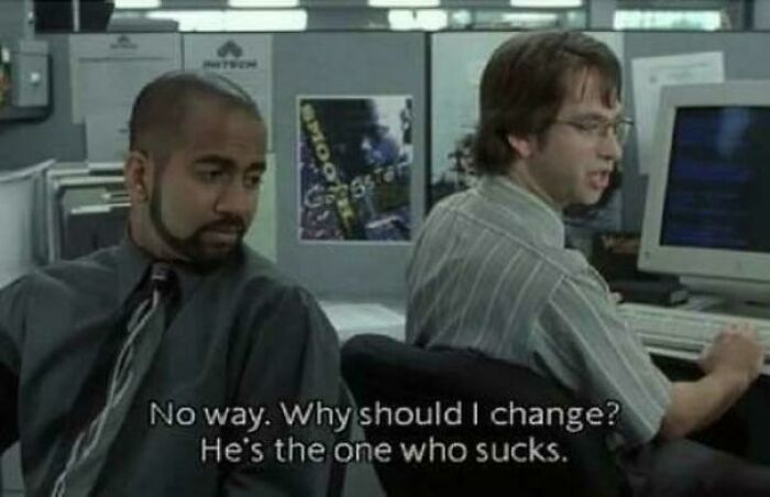 Two coworkers in an office cubicle discussing change, capturing wholesome and funny dads doing their best humor.