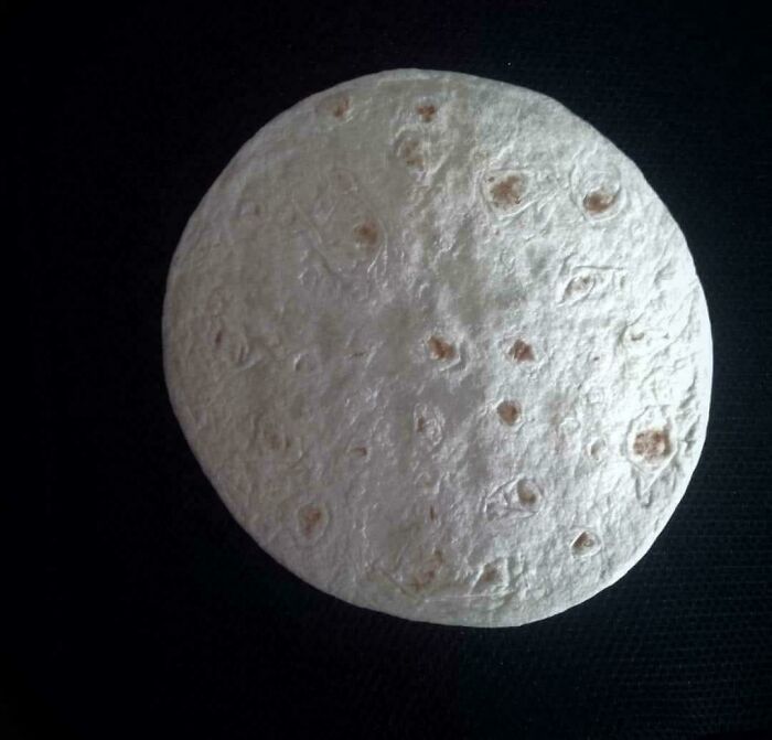Tortilla resembling the moon, showcasing delightfully British humor.