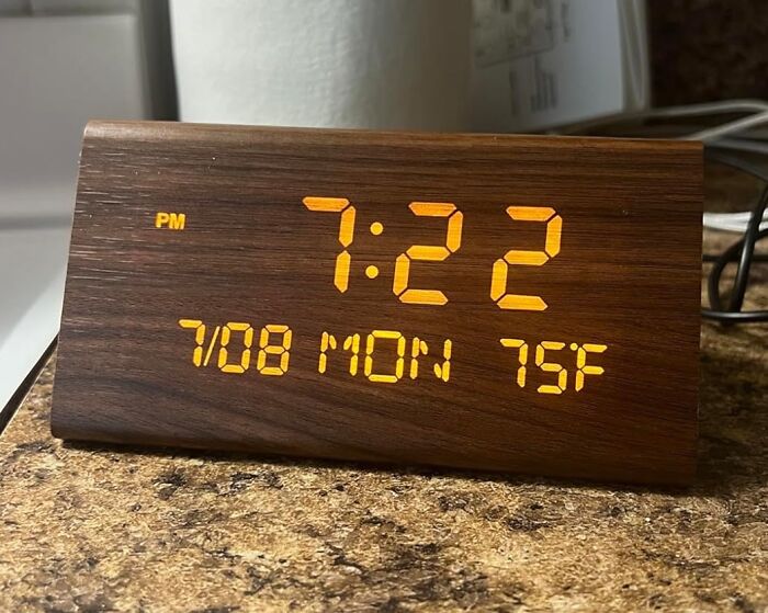 Wooden digital alarm clock showing time, date, and temperature, one of the brilliant Amazon finds for everyday use.