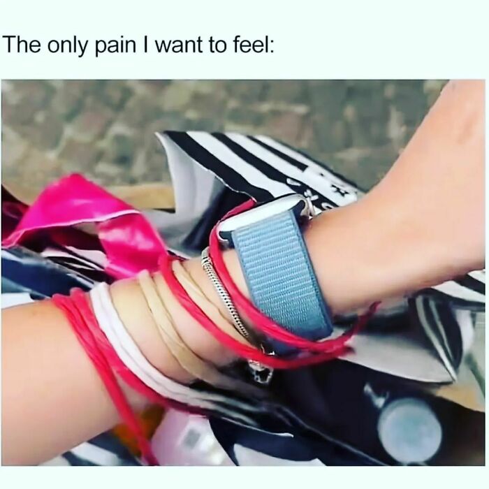 Person's wrist wrapped with colorful bracelets and a hair tie, showing a relatable meme about pain with memes theme.