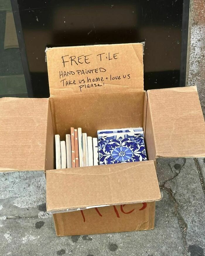 Free hand-painted tiles left on NYC curb in a cardboard box for anyone to take home and love.
