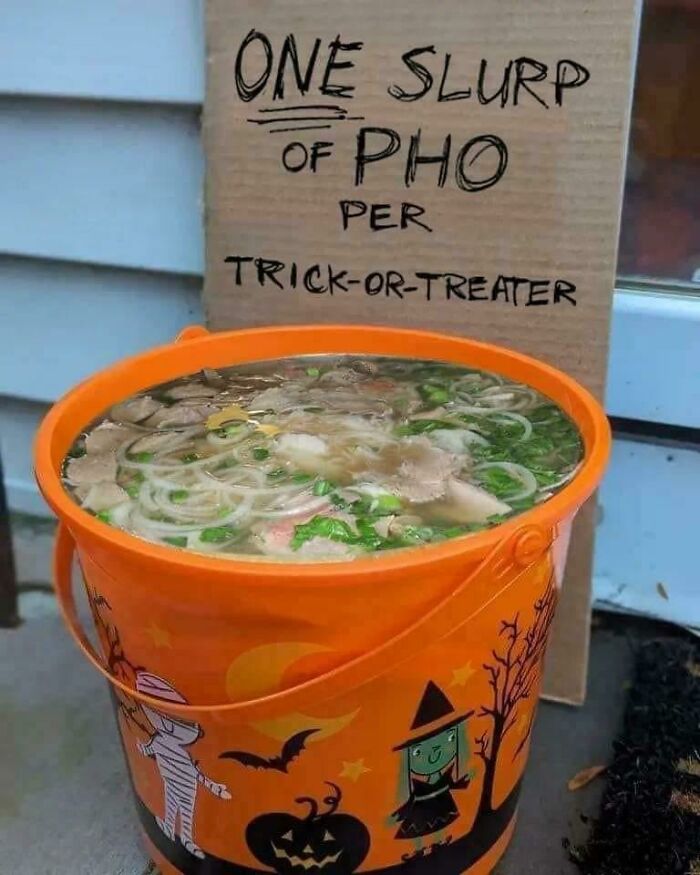 Halloween bucket filled with pho, sign says "one slurp per trick-or-treater."