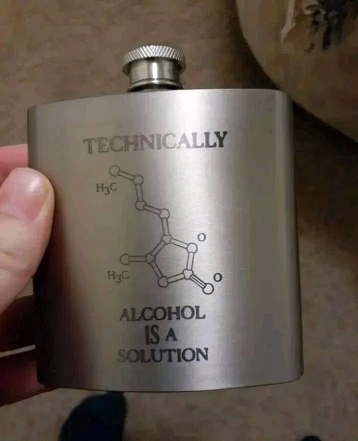 Flask with science humor meme showing molecular structure and joke about alcohol being a solution.
