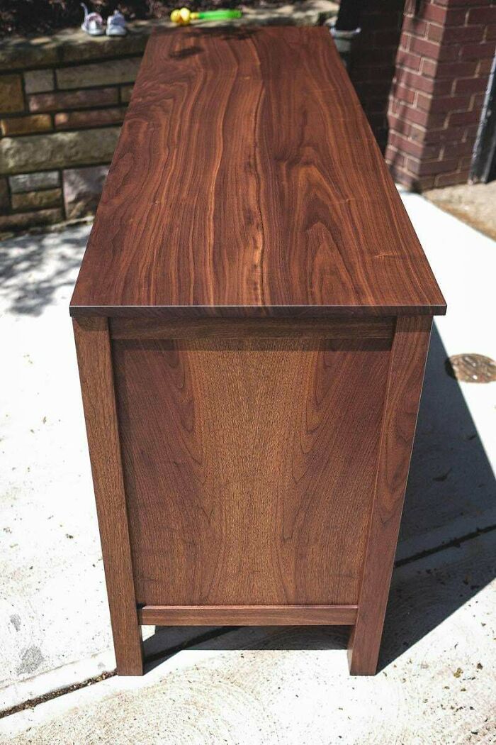 A handcrafted wooden bench showcasing impressive woodworking skills.